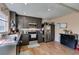 Modern kitchen with stainless steel appliances, dark cabinets and wood-look floors at 2454 Paradise Village Way, Las Vegas, NV 89120