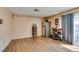 Bright living area featuring wood-look floors and a sliding glass door at 2454 Paradise Village Way, Las Vegas, NV 89120