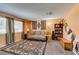 Cozy living room with patterned rug, comfortable couch, and wall decor at 2454 Paradise Village Way, Las Vegas, NV 89120