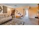 Living room showcasing neutral paint, carpet, a geometric accent wall, and entry into another room at 2454 Paradise Village Way, Las Vegas, NV 89120