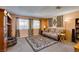 Carpeted living room with comfortable seating and natural light from the windows at 2454 Paradise Village Way, Las Vegas, NV 89120