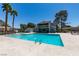 Community pool featuring clear blue water and palm trees in the background at 2454 Paradise Village Way, Las Vegas, NV 89120