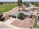 Aerial view of the house with a two car garage near a golf course at 2559 Winterwood Blvd, Las Vegas, NV 89142