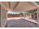 Relaxing covered patio with tile flooring and a built in outdoor grill at 2559 Winterwood Blvd, Las Vegas, NV 89142