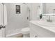 Modern bathroom featuring white tile and shower stall with glass door at 2559 Winterwood Blvd, Las Vegas, NV 89142