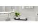 Bathroom sink and countertop with modern fixtures, decor, and a sleek mirror at 2559 Winterwood Blvd, Las Vegas, NV 89142