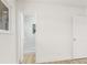 Bright bedroom with wood-look floors, white walls and an ensuite bathroom at 2559 Winterwood Blvd, Las Vegas, NV 89142