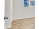 Bright bedroom with wood-look floors and white walls with a window at 2559 Winterwood Blvd, Las Vegas, NV 89142
