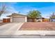 Charming single-story home with a well-maintained front yard and an attached two-car garage at 2559 Winterwood Blvd, Las Vegas, NV 89142
