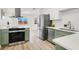 Updated kitchen with stainless steel appliances, modern cabinets and countertops, and stylish fixtures at 2559 Winterwood Blvd, Las Vegas, NV 89142