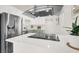Close-up of the kitchen with stainless steel refrigerator, modern countertops and stainless steel hood at 2559 Winterwood Blvd, Las Vegas, NV 89142