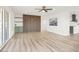Spacious living room featuring stylish wood-look floors and sliding glass doors at 2559 Winterwood Blvd, Las Vegas, NV 89142