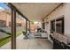 Covered patio with outdoor seating, string lights, and a built-in BBQ at 2860 Galena Peak Ln, Las Vegas, NV 89156