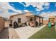 Spacious backyard with patio, seating, BBQ, and playground at 2860 Galena Peak Ln, Las Vegas, NV 89156