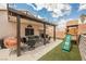 Outdoor patio with comfortable seating and backyard playground with slide at 2860 Galena Peak Ln, Las Vegas, NV 89156
