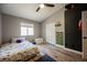 Comfortable bedroom with wood floors, closet, and a window for natural light at 2860 Galena Peak Ln, Las Vegas, NV 89156