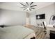 Bright and airy bedroom with wood-look flooring and a modern ceiling fan at 2860 Galena Peak Ln, Las Vegas, NV 89156