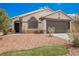 Charming home with desert landscaping, stone accents, and a two-car garage at 2860 Galena Peak Ln, Las Vegas, NV 89156
