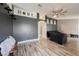Spacious living room with modern decor, archways, stylish lighting, and hardwood floors at 2860 Galena Peak Ln, Las Vegas, NV 89156