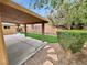 Relaxing backyard with a covered patio, low-maintenance landscaping, and a gravel area at 310 Sorrelwood St, Henderson, NV 89014