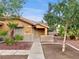 Attractive single-story home showcasing a welcoming entrance and well-kept desert landscaping at 310 Sorrelwood St, Henderson, NV 89014