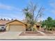 Inviting single-story home with a two-car garage and desert landscaping for easy maintenance at 310 Sorrelwood St, Henderson, NV 89014