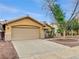 Charming single-story home featuring a well-maintained lawn and two-car garage at 310 Sorrelwood St, Henderson, NV 89014
