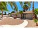 A large backyard with desert landscaping, and a cozy patio area at 3143 La Mesa Dr, Henderson, NV 89014