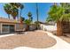 Backyard featuring a patio set and desert landscaping at 3143 La Mesa Dr, Henderson, NV 89014