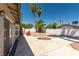 Backyard features a concrete patio, desert landscaping, a firepit, and a block wall at 3143 La Mesa Dr, Henderson, NV 89014
