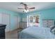Bedroom with carpet, ceiling fan, sliding glass doors to backyard, and dressers at 3143 La Mesa Dr, Henderson, NV 89014