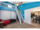 Spacious bedroom with blue accent wall, loft area, and closet space at 3143 La Mesa Dr, Henderson, NV 89014