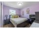 Lavender bedroom with plush carpet features queen bed, art, and window with blinds at 3143 La Mesa Dr, Henderson, NV 89014