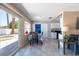 Bright dining area featuring tile flooring, neutral walls, and sliding glass door to the outdoor patio at 3143 La Mesa Dr, Henderson, NV 89014
