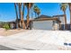 Charming single story home with a large driveway and well maintained lawn at 3143 La Mesa Dr, Henderson, NV 89014