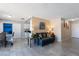 Open-concept living room with a dining area, comfortable seating and neutral décor at 3143 La Mesa Dr, Henderson, NV 89014