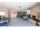 Inviting living room featuring comfortable seating, a fireplace, and a media center at 3143 La Mesa Dr, Henderson, NV 89014