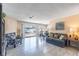 Bright living room featuring tile floors, and sliding glass doors to the backyard at 3143 La Mesa Dr, Henderson, NV 89014