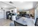 Open-concept kitchen and living space with a dining table and ample seating at 3143 La Mesa Dr, Henderson, NV 89014