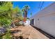 A white single story home with a shed in the backyard at 3368 Seneca Dr, Las Vegas, NV 89169