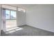 Sunlit bedroom features large window, and soft gray carpeting at 3368 Seneca Dr, Las Vegas, NV 89169