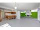 Spacious room with modern fireplace, open kitchen design, tile floors, and ample natural light at 3368 Seneca Dr, Las Vegas, NV 89169