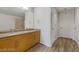 Bathroom with double vanity, granite counters, and a glass-enclosed shower at 353 E Bonneville Ave # 555, Las Vegas, NV 89101