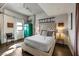 Comfortable bedroom with a tufted headboard, vibrant storage, and modern decor at 353 E Bonneville Ave # 555, Las Vegas, NV 89101