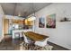 Open concept living with dining area that has modern light fixture and adjacent kitchen view at 353 E Bonneville Ave # 555, Las Vegas, NV 89101