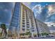Striking exterior of a high-rise condo building with sleek glass facade and private balconies at 353 E Bonneville Ave # 555, Las Vegas, NV 89101