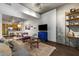 Open concept living and dining area with adjacent kitchen, TV, and modern furniture at 353 E Bonneville Ave # 555, Las Vegas, NV 89101