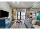 Comfortable living room with a view to the outside balcony and a TV at 353 E Bonneville Ave # 555, Las Vegas, NV 89101