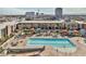 Resort-style pool area with lounge chairs, palm trees, and colorful cabanas at 353 E Bonneville Ave # 555, Las Vegas, NV 89101