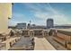 Spacious rooftop deck with outdoor seating and panoramic city views at 353 E Bonneville Ave # 555, Las Vegas, NV 89101
